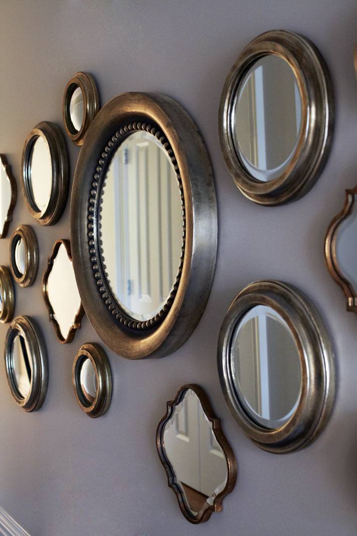 Россыпь круглых зеркал на стене для украшения дома фото